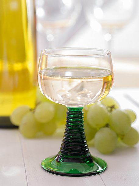A glass of white wine in the roman glass - Photo, Image