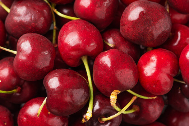 Cherry background top view. Cherry fruits, food background. - Photo, Image