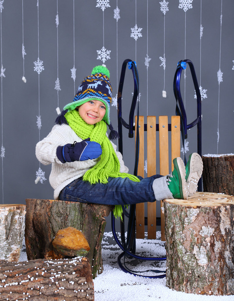 Winter Fashion. Portrait of adorable happy boy. - Fotó, kép