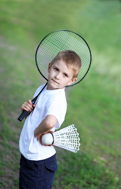 The boy with a racket - Foto, afbeelding