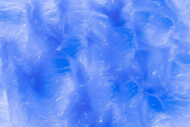 Μπλε καλλυντικό φόντο λεκέδων. Creamy balm υφή προϊόν closeup. Δείγμα προϊόντος ομορφιάς ενυδάτωσης και καθαρισμού. - Φωτογραφία, εικόνα