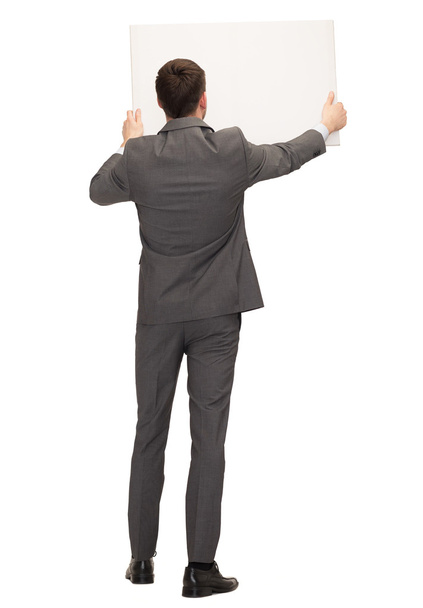 businessman or teacher with white board from back - Foto, Imagen