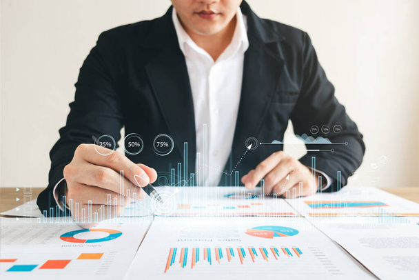 Businessman touching virtual screen Graph analysis of business growth and investment, strategic planning to increase sales profits, long-term business plan. - Photo, Image