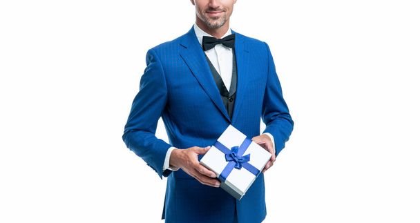 smiling man in blue suit with gift box isolated on white. valentines day. - Foto, immagini