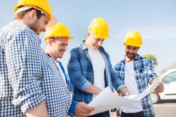 group of builders with tablet pc and blueprint - Valokuva, kuva