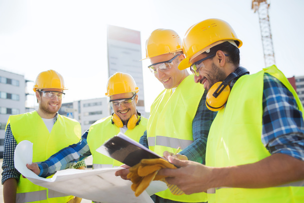 group of builders with tablet pc and blueprint - Photo, image