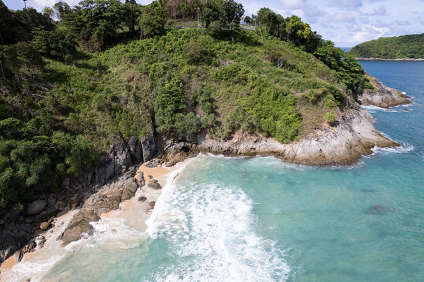 Aerial view of sea crashing waves White foaming waves on sandy shore. Top view beach in Phuket Thailand - Photo, Image