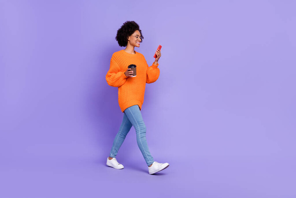 Full length body size view of beautiful trendy cheery girl going using device free time isolated on bright purple violet color background. - Foto, Imagem