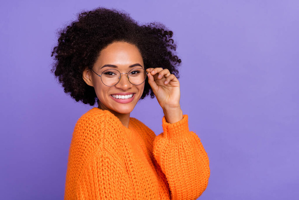 Profile side view portrait of attractive intellectual cheerful girl touching specs isolated over bright purple violet color background. - Foto, imagen