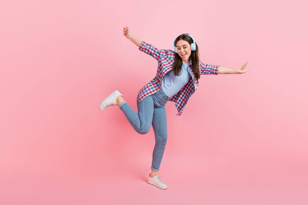 Full size photo of charming energetic cheerful girl dancing in nightclub isolated on pink color background. - Foto, Imagen
