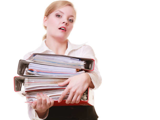Businesswoman carrying stack of folders - Fotoğraf, Görsel