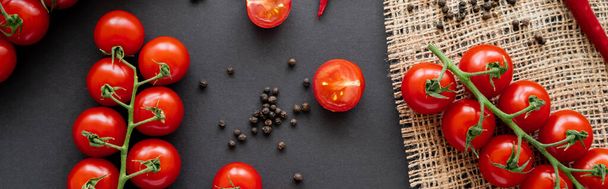 Top view of ripe vegetables and peppercorns on sackcloth on black background, banner  - Photo, Image