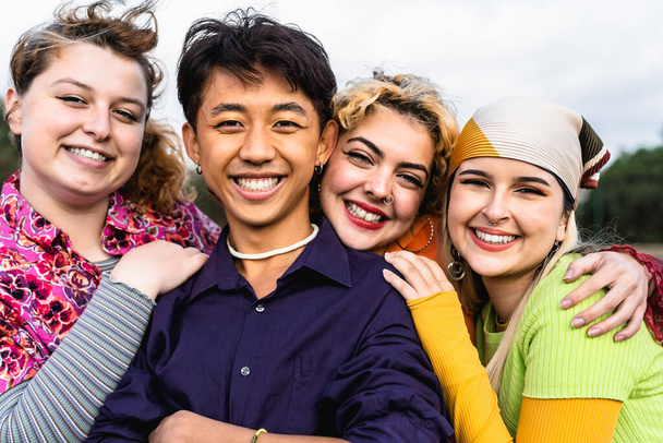 Happy young diverse friends having fun hanging out together - Youth people millennial generation concept - Photo, Image