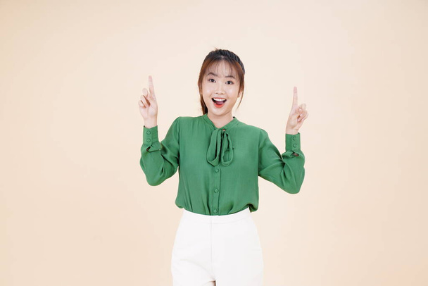 Asian young beautiful woman with hand gesture, show the expression of interesting, isolated on background - Photo, Image