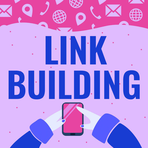 Znak tekstowy pokazujący Link Building, Business concept SEO Term Exchange Links Acquire Hyperlinks Indexed Hand Holding Mobile Phone Pressing Application Button Showing Technology. - Zdjęcie, obraz