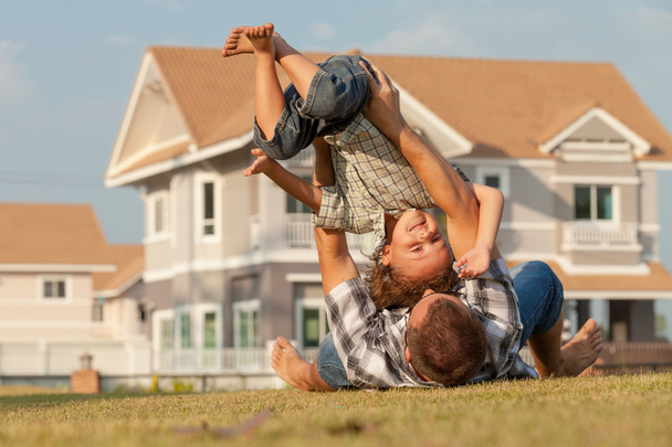 father and son playing on the grass - Fotoğraf, Görsel