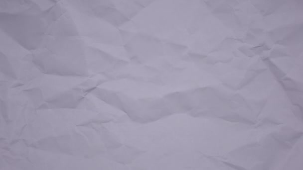Crumpled wrinkled sheet of paper background texture. Stop motion animation. Seamless looping. - Footage, Video