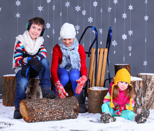 Winter Fashion. Adorable happy boy and girls. - Фото, изображение