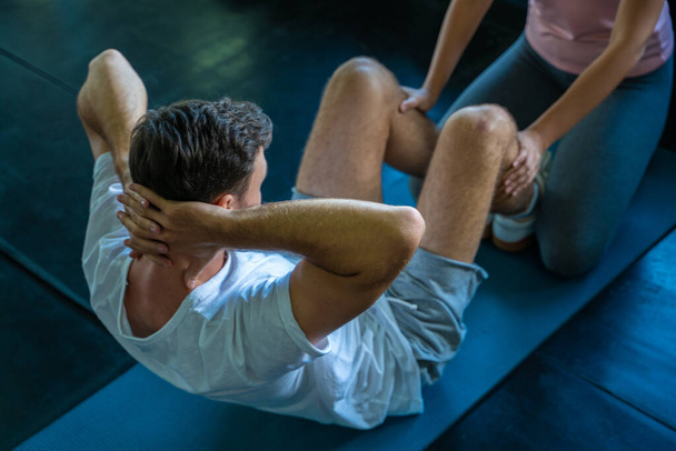 Men and women trainning together sit up make Rectus Abdominis muscular in sport gym - Φωτογραφία, εικόνα