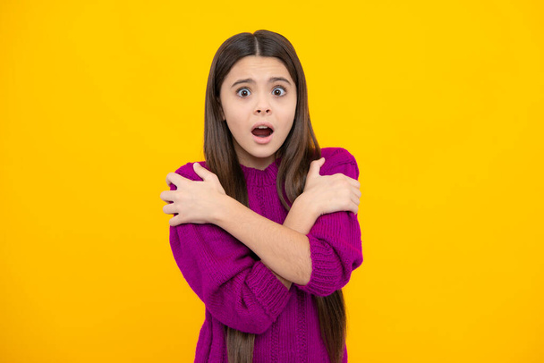 Surprised emotions of young teenager girl. Teenager child girl with shocked facial expression. Surprised face expression, isolated on yellow background. Funny surprise - Photo, image