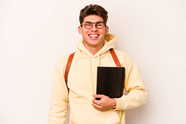 Young student caucasian man isolated on white background happy, smiling and cheerful. - Zdjęcie, obraz