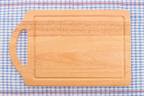 planche à découper en bois sur nappe
 - Photo, image