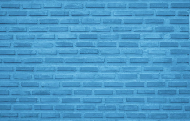 Brick wall painted with pale blue paint pastel calm tone texture background. Brickwork and stonework flooring interior rock old pattern clean concrete grid uneven bricks design stack backdrop. - Foto, Imagen