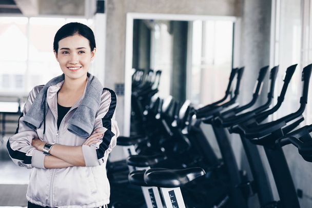 Smiling sport women standing portrait in private gym after workout - Foto, Imagem