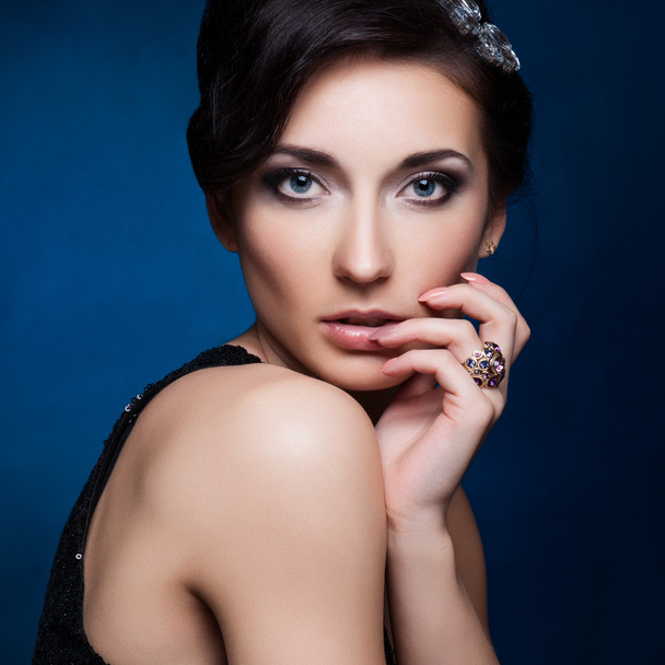 Portrait of beautiful brunette woman in black dress. Cosmetic Eyeshadows. Fashion photo - Фото, изображение