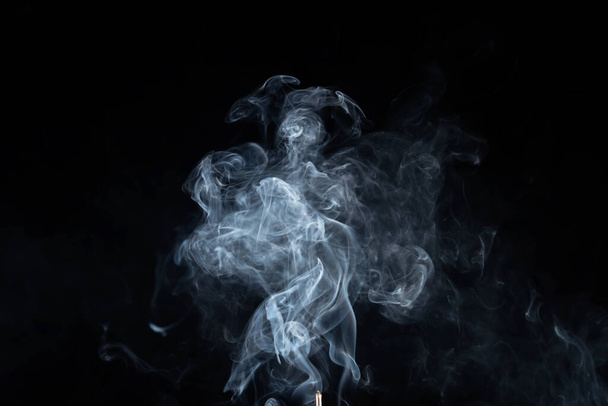 incense stick with smoke against black background - Fotoğraf, Görsel