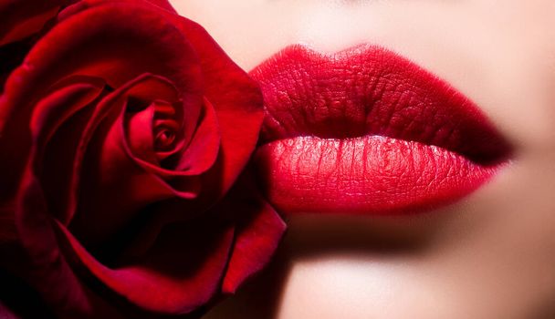 Beauty Red Lips Makeup Detail. Lips with lipstick closeup. Beautiful woman lips with rose - Photo, Image