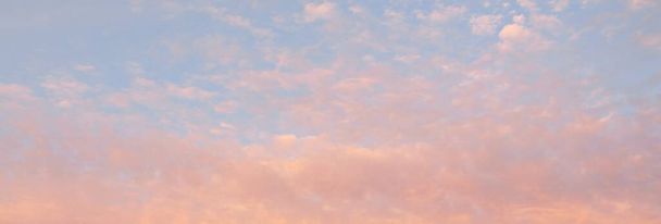 Clear blue sky with glowing pink and golden cirrus and cumulus clouds. Sunrise. Dramatic cloudscape. Concept art, meteorology, heaven, hope, peace, graphic resources, picturesque panoramic scenery - Фото, изображение