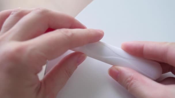 Female hands holding pregnancy test. Woman making test - result is positive, show two lines. Pregnancy concept, family planning. - Footage, Video