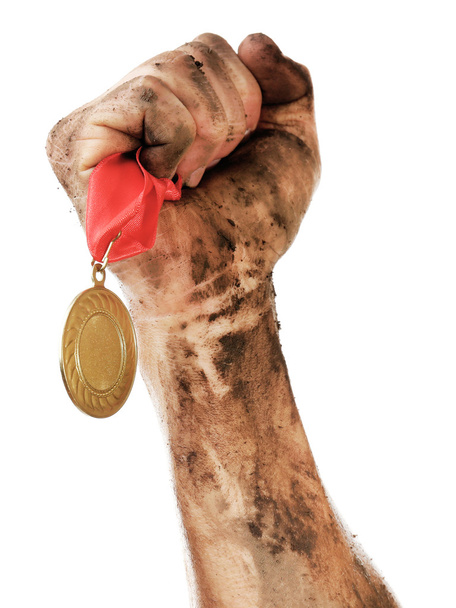 Médaille d'or à la main
 - Photo, image