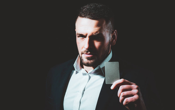 Businessman with a credit card. Business man holds a creditcard - Photo, Image