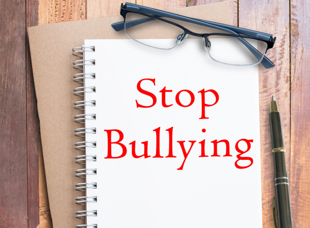 Stop Bullying in the Workplace text on notebook, words typography top view lettering concept. Concepto y diseño empresarial. - Foto, Imagen