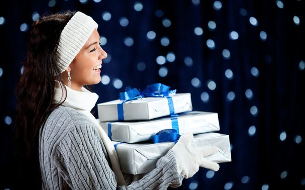 Winter: Woman with Stack of Gifts Laughing - Fotoğraf, Görsel