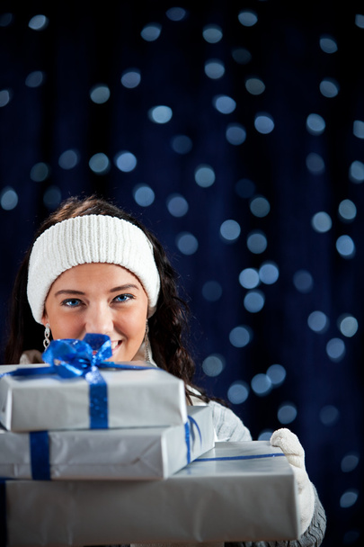 Winter: Peeking From Behind Stack of Gifts - Foto, imagen