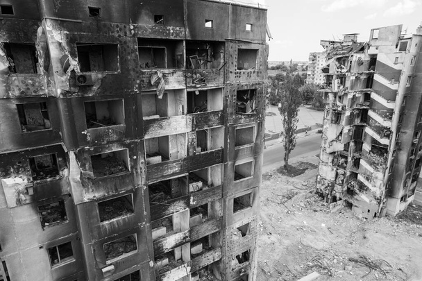 This stock black and white photo shows the aftermath of the war in Ukraine - a destroyed residential building in Borodyanka, Bucha district - Fotoğraf, Görsel