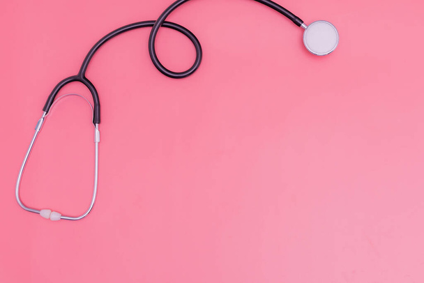 stethoscope on pink background and copy space - 写真・画像
