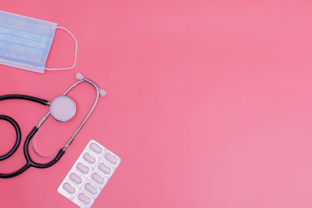 stethoscope on pink background and copy space - 写真・画像