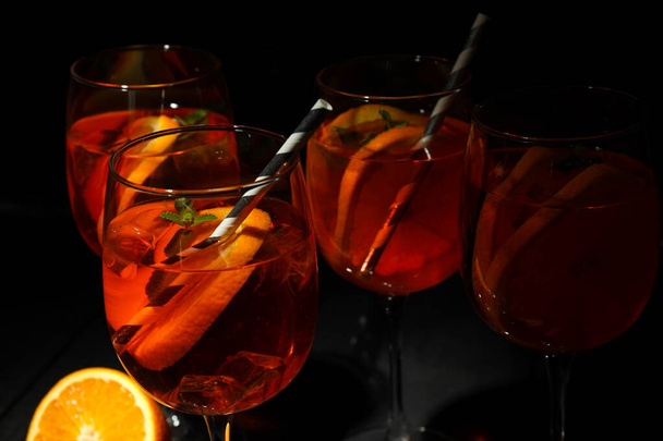 Concept of summer alcohol drink, Aperol Spritz against dark background - Фото, зображення