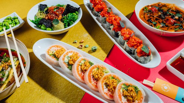 Fresh and tasty sushi rolls on table, sushi bar menu, asian food tabl - Fotó, kép
