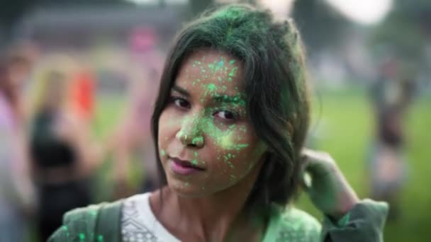 Close up of multiracial woman looking at camera at holi festival. Shot with RED helium camera in 8K.  - Video