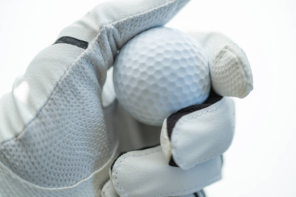 Golf Ball in Hand of a Player. Sportsman Wearing Golf Glove on His Hand. Close Up. - Фото, зображення