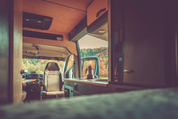 Autumn Morning While Traveling in a Motorhome. The Door is Open, Coffee is Boiling in a Coffee Pot on the Stove. Quite and Peaceful Place. - Foto, Imagen