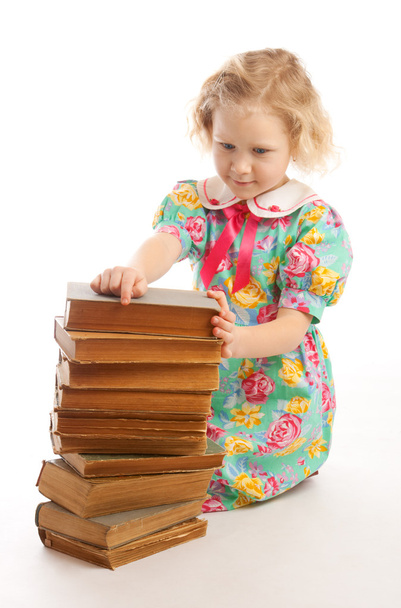 Girl sitting books stack - Foto, Imagen