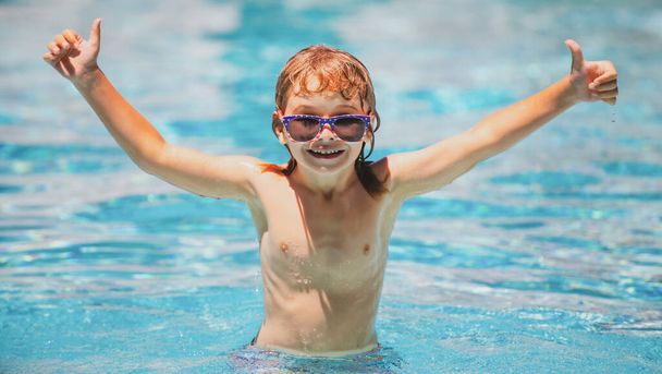 Cute child boy swim in swimming pool, summer water background with copy space. Funny kids face. Excited funny child in sunglasses in pool in summer day - Photo, Image