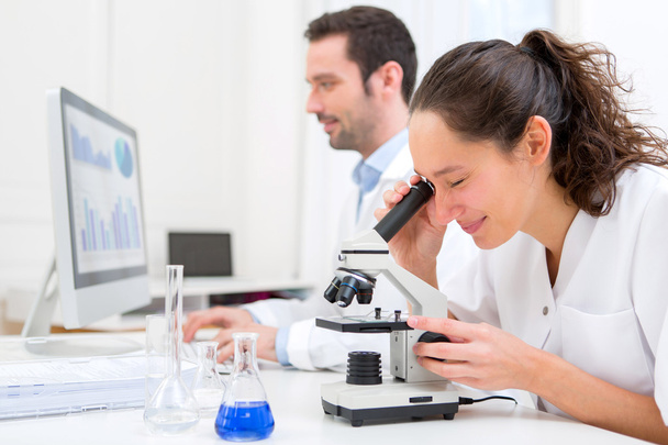 Young attractive woman working in a laboratory - Foto, imagen