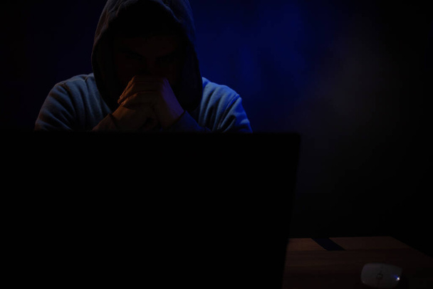 Hacker man working laptop computer. Hacker attack in dark room background - Photo, Image